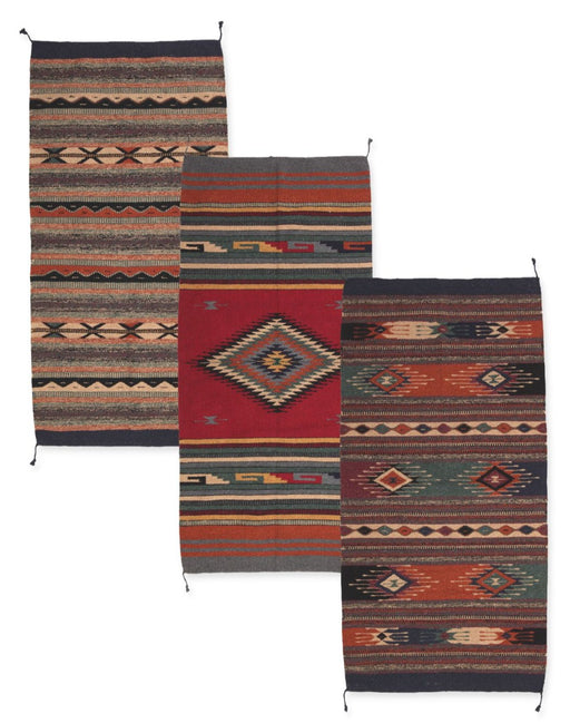 3 pack assortment of 20" x 40" handwoven acrylic rugs in southwest-style designs.