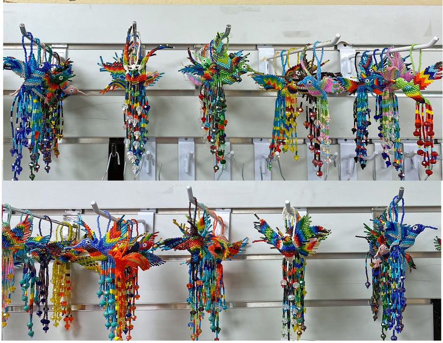 Beautifully beaded hummingbird ornaments shipped in assorted colors and patterns.