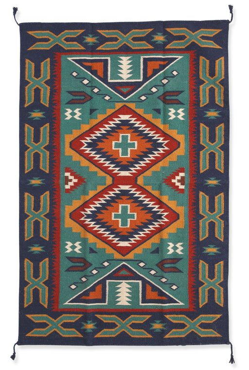 6' x 9' intricate wool rug in southwest style design. In the colors of navy, teal, gold, orange, white, and red.