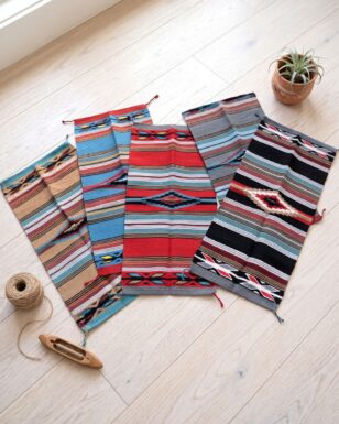 12 Assorted 20"x40" Feather Hawkeye Rugs!